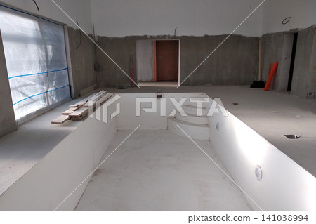 Interior of a house with big swimmig pool under renovation works. 141038994