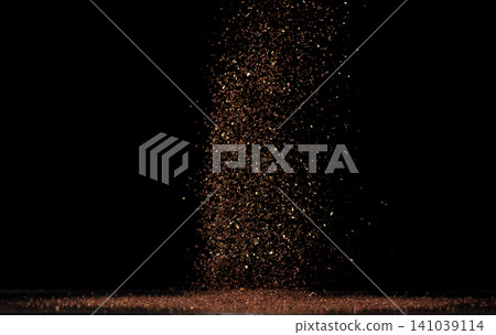 Roasted Coffee powder ground dust splash explosion in mid Air. Ground Coffee roasted powder dust fly explosion, Coffee crushed ground float pouring. Black background Isolated Roasted Coffee powder ground dust splash explosion in mid Air. Ground Coffee roasted powder dust fly explosion, Coffee crushed ground float pouring. Black background Isolated 141039114