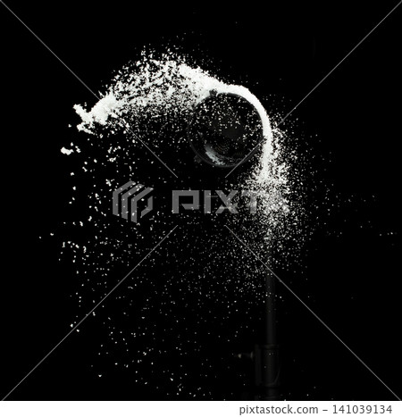 Fluffy White snow splash flying or throwing in mid air. Snowfall on Black background isolated. Snow dust element falling over dark night Fluffy White snow splash flying or throwing in mid air. Snowfall on Black background isolated. Snow dust element falling over dark night 141039134