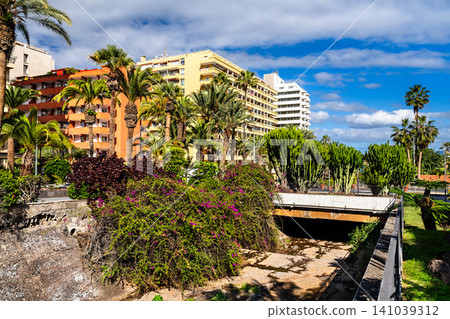 Scenic view and lush tropical gardens at Paseo Martianez in Puerto de la Cruz, Tenerife, Spain. Scenic view and lush tropical gardens at Paseo Martianez in Puerto de la Cruz, Tenerife, Spain. 141039312