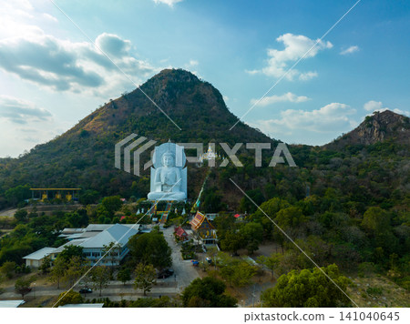 Aerial of white big Buddha front of the big mountain Aerial of white big Buddha front of the big mountain 141040645