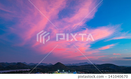 Aerial view Vibrant Sunset Over Mountain Peaks Aerial view Vibrant Sunset Over Mountain Peaks 141040670