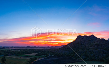 Aerial view of colorful Sunset Over sunflower field. Aerial view of colorful Sunset Over sunflower field. 141040673