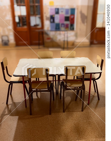 Empty classroom with small chairs and table anticipating students returning for back to school, learning, education, and creative activities in a school setting Empty classroom with small chairs and table anticipating students returning for back to school, learning, education, and creative activities in a school setting 141040930