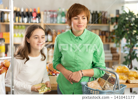 Family choosing food at the supermarket Family choosing food at the supermarket 141041177