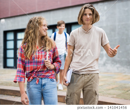 Teenagers going home after school and talking Teenagers going home after school and talking 141041456