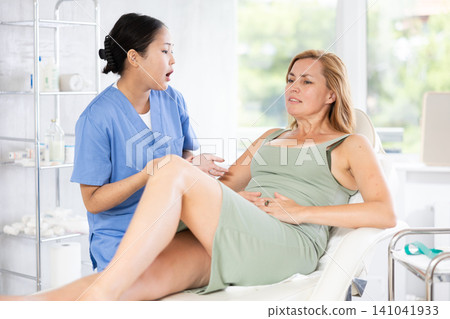 Young doctor conducts consultation Young doctor conducts consultation 141041933
