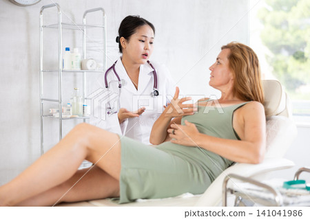 Young doctor conducts consultation Young doctor conducts consultation 141041986