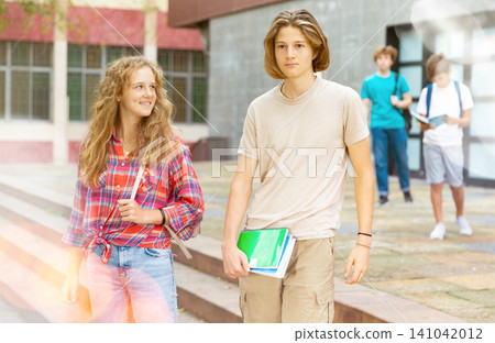Teens coming home after school classes Teens coming home after school classes 141042012