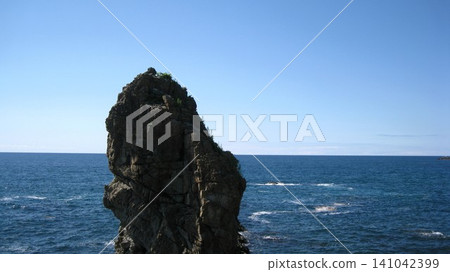 Summer's blue sky, blue sea, and towering, strangely shaped rocks Summer's blue sky, blue sea, and towering, strangely shaped rocks 141042399