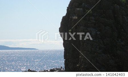 Summer's blue sky, blue sea, and towering, strangely shaped rocks Summer's blue sky, blue sea, and towering, strangely shaped rocks 141042403
