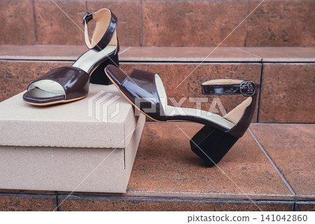 Elegant patent leather sandals high heels blank product for branding displayed. New casual female sandals no-brand footwear e-commerce. No logo product unbranded fashion footwear Elegant patent leather sandals high heels blank product for branding displayed. New casual female sandals no-brand footwear e-commerce. No logo product unbranded fashion footwear 141042860