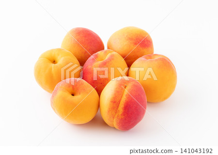 Apricots on a white background Apricots on a white background 141043192