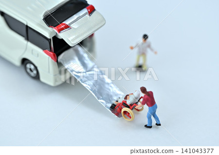 Image of loading a wheelchair into a vehicle for elderly care and welfare. Image of loading a wheelchair into a vehicle for elderly care and welfare. 141043377