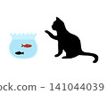 A goldfish bowl and the silhouette of a cat interested in goldfish. 141044039