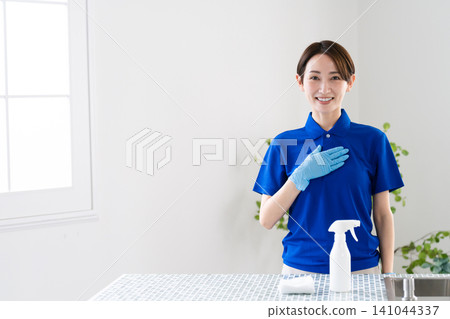Young woman doing house cleaning lifestyle image Young woman doing house cleaning lifestyle image 141044337