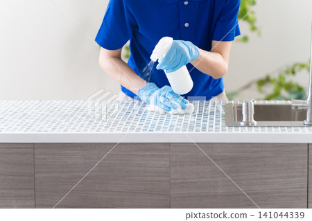 Young woman doing house cleaning lifestyle image 141044339