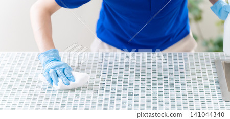 Young woman doing house cleaning lifestyle image 141044340