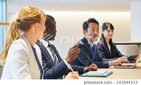 Group of multinational business people meeting in a conference room Group of multinational business people meeting in a conference room 141044513