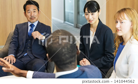Group of multinational business people having a conversation in a lobby Group of multinational business people having a conversation in a lobby 141044562