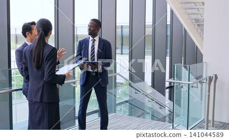 Group of multinational business people having a conversation in a lobby Group of multinational business people having a conversation in a lobby 141044589