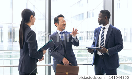 Group of multinational business people having a conversation in a lobby Group of multinational business people having a conversation in a lobby 141044590