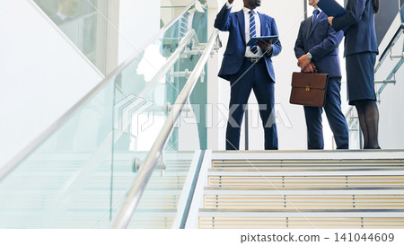 Group of multinational business people having a conversation in a lobby Group of multinational business people having a conversation in a lobby 141044609