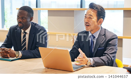 A group of multinational business people having a meeting A group of multinational business people having a meeting 141044637