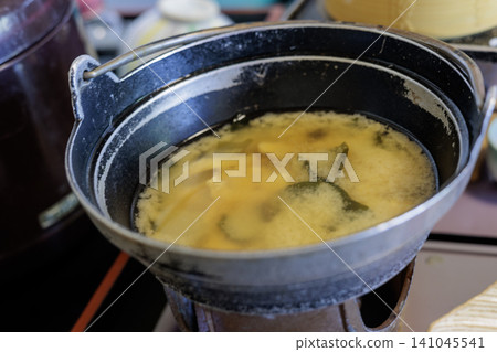 A hearty, warm miso soup served in an iron pot. 141045541
