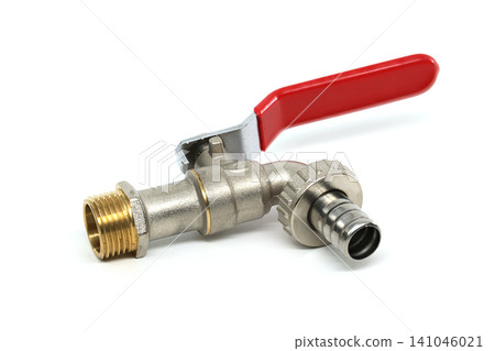 Plumbing ball valve with red handle and brass fitting on white background Plumbing ball valve with red handle and brass fitting on white background 141046021