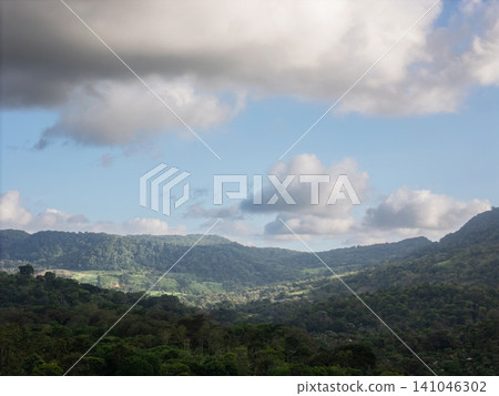 Clouds above green hills in Nicaragua during the day 141046302