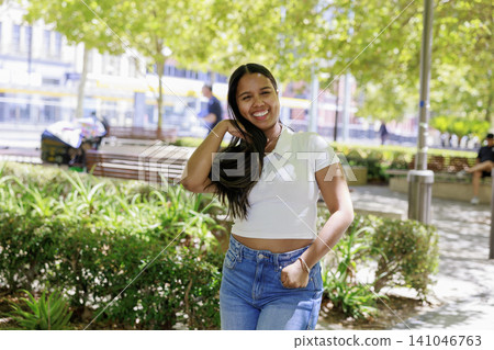 A woman relaxing in the park A woman relaxing in the park 141046763