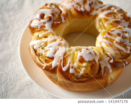 Apple ring bread with icing decoration Apple ring bread with icing decoration 141047176