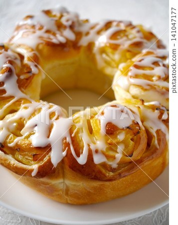 Apple ring bread with icing decoration Apple ring bread with icing decoration 141047177