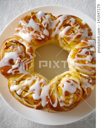 Apple ring bread with icing decoration Apple ring bread with icing decoration 141047179