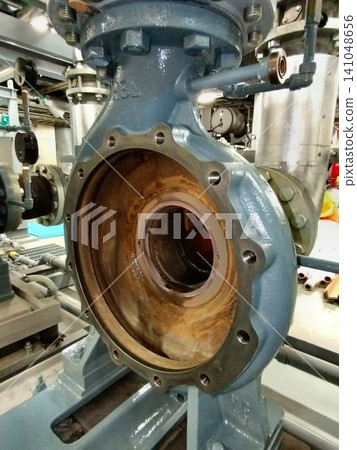 Water pump undergoing disassembly and maintenance. Water pump undergoing disassembly and maintenance. 141048656