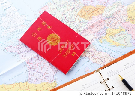 Passport - Image of preparing a passport (regular 10-year red passport) and planning a trip abroad Passport - Image of preparing a passport (regular 10-year red passport) and planning a trip abroad 141048975