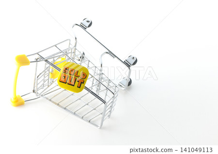 A shopping cart photographed against a white background. A shopping cart photographed against a white background. 141049113