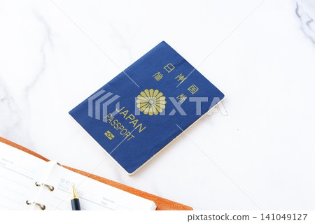 Passport - Image of preparing a passport (5-year general passport, navy blue) and planning a trip abroad Passport - Image of preparing a passport (5-year general passport, navy blue) and planning a trip abroad 141049127