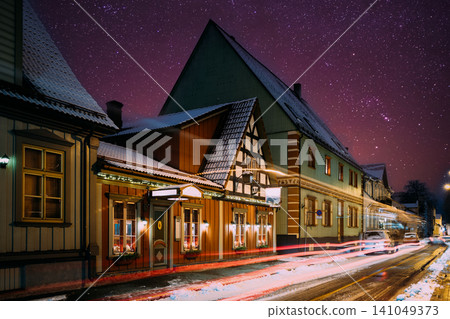 Car light trails on Kuninga street passing Restaurant in Parnu Old Town at winter night Car light trails on Kuninga street passing Restaurant in Parnu Old Town at winter night 141049373