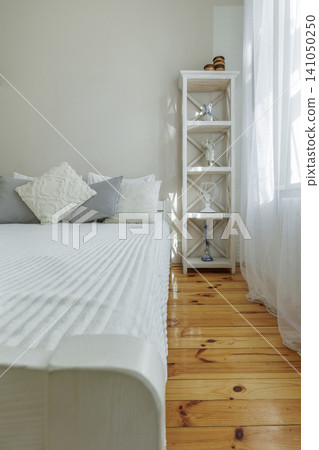 Cozy Bedroom Corner with Wooden Bed and Shelving Unit Cozy Bedroom Corner with Wooden Bed and Shelving Unit 141050250