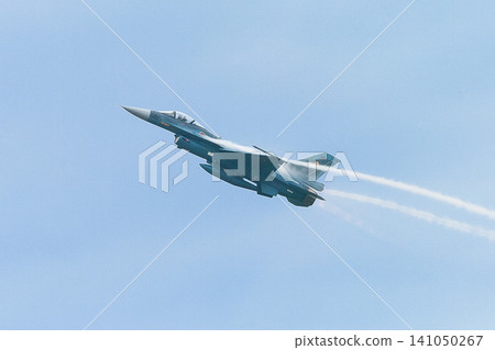 A Japan Air Self-Defense Force F-2 fighter jet rapidly ascends. 141050267