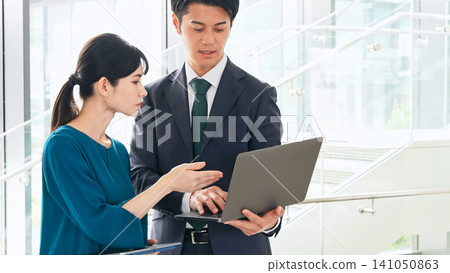 A group of business people having a meeting with digital devices A group of business people having a meeting with digital devices 141050863
