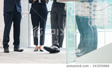 A group of business people having a meeting with digital devices A group of business people having a meeting with digital devices 141050866