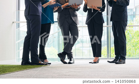 A group of business people having a meeting with digital devices 141050868