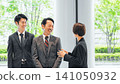 Group of executive business people having a conversation in a lobby 141050932
