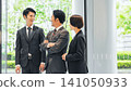 Group of executive business people having a conversation in a lobby 141050933