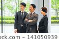 Group of executive business people standing in a lobby 141050939