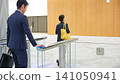 Business person passing through the entrance gate 141050941