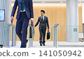 Business person passing through the entrance gate 141050942